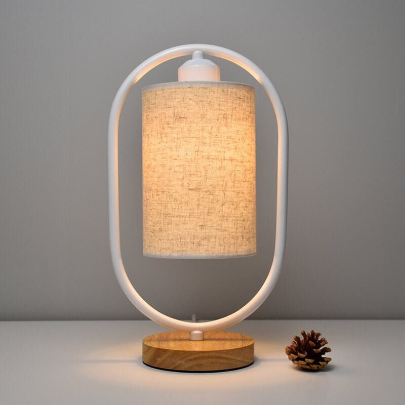 Bordslampa med cylindrisk skärm och oval ram
