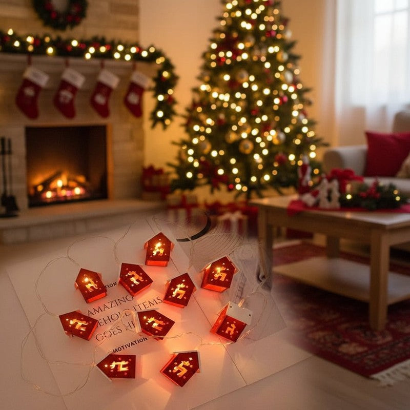 Juldekoration med LED-ljuskedja och små husformade lyktor