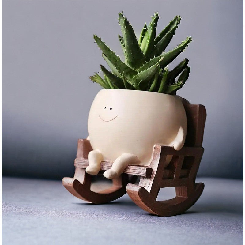 Planter med leende ansikte - Resin med gungstol