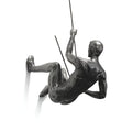 Set av väggskulpturer - klättrande figurer
